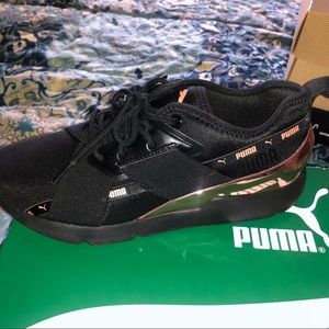Puma sneakers. Black with shiny rose gold accents.